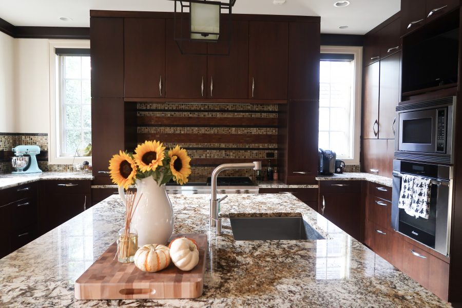 Our current kitchen, dark wood cabinets and granite countertops