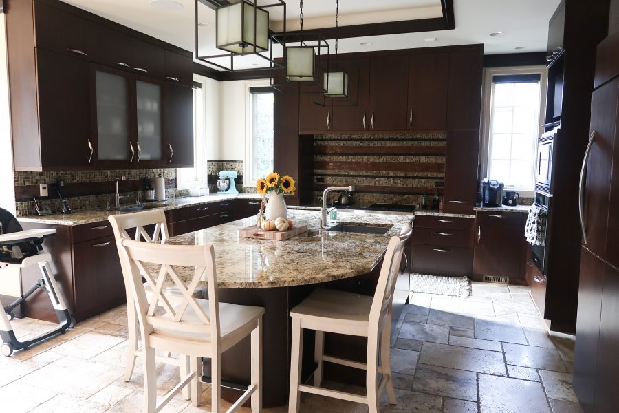 Our current kitchen, dark wood cabinets and granite countertops