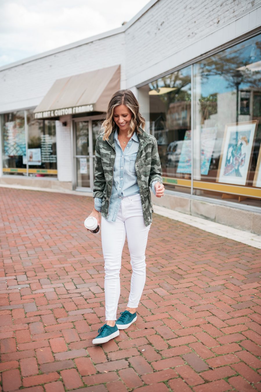 White denim for fall, chambray shirt, camo jacket, and sneakers
