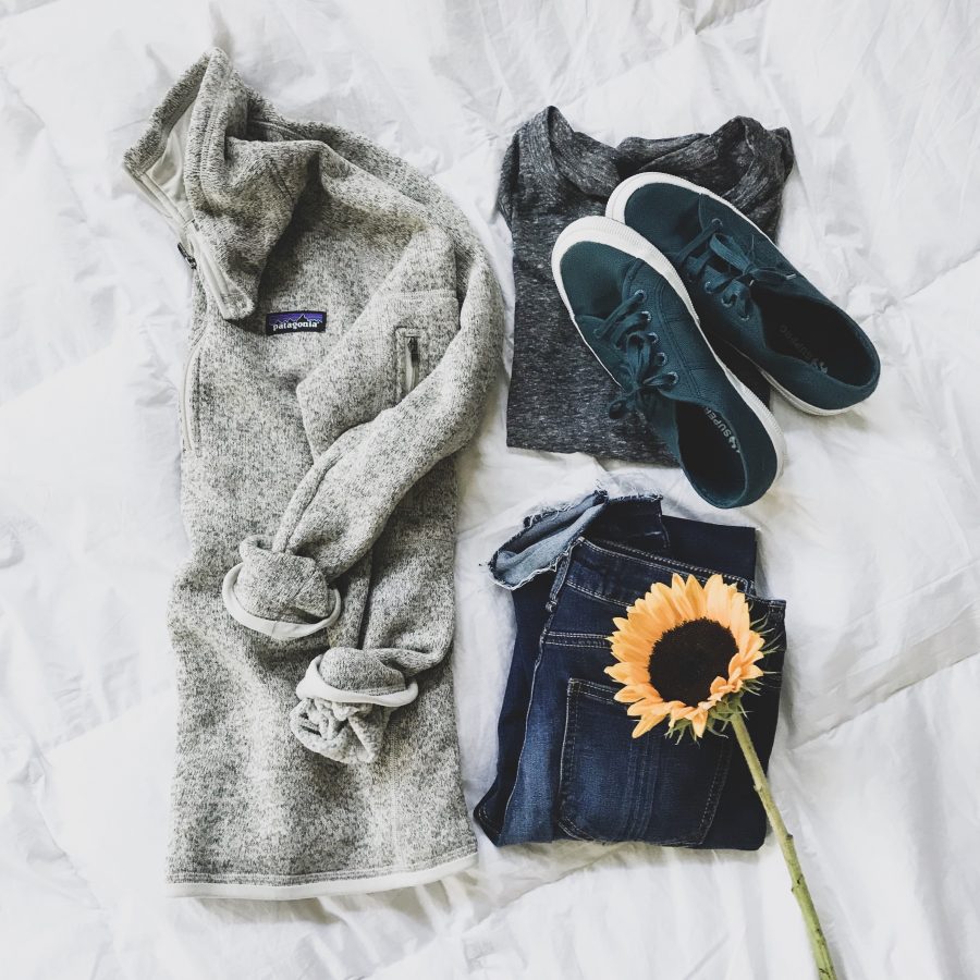 Patagonia jacket, denim, and sneakers