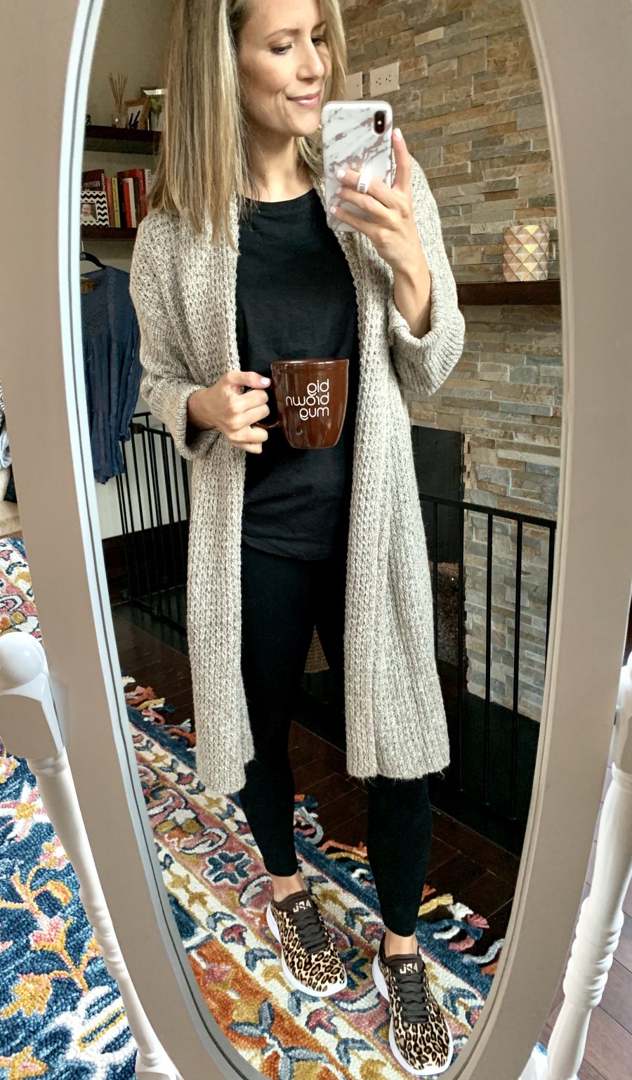 Second trimester outfit ideas, black tee, leggings, cardigan, and leopard sneakers