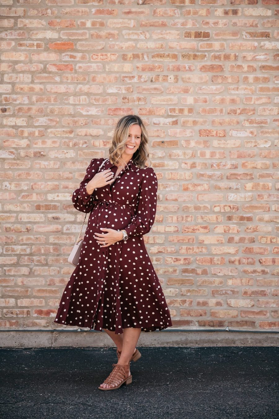Maternity style: polka dot shirt dress, cross body bag, and sandals