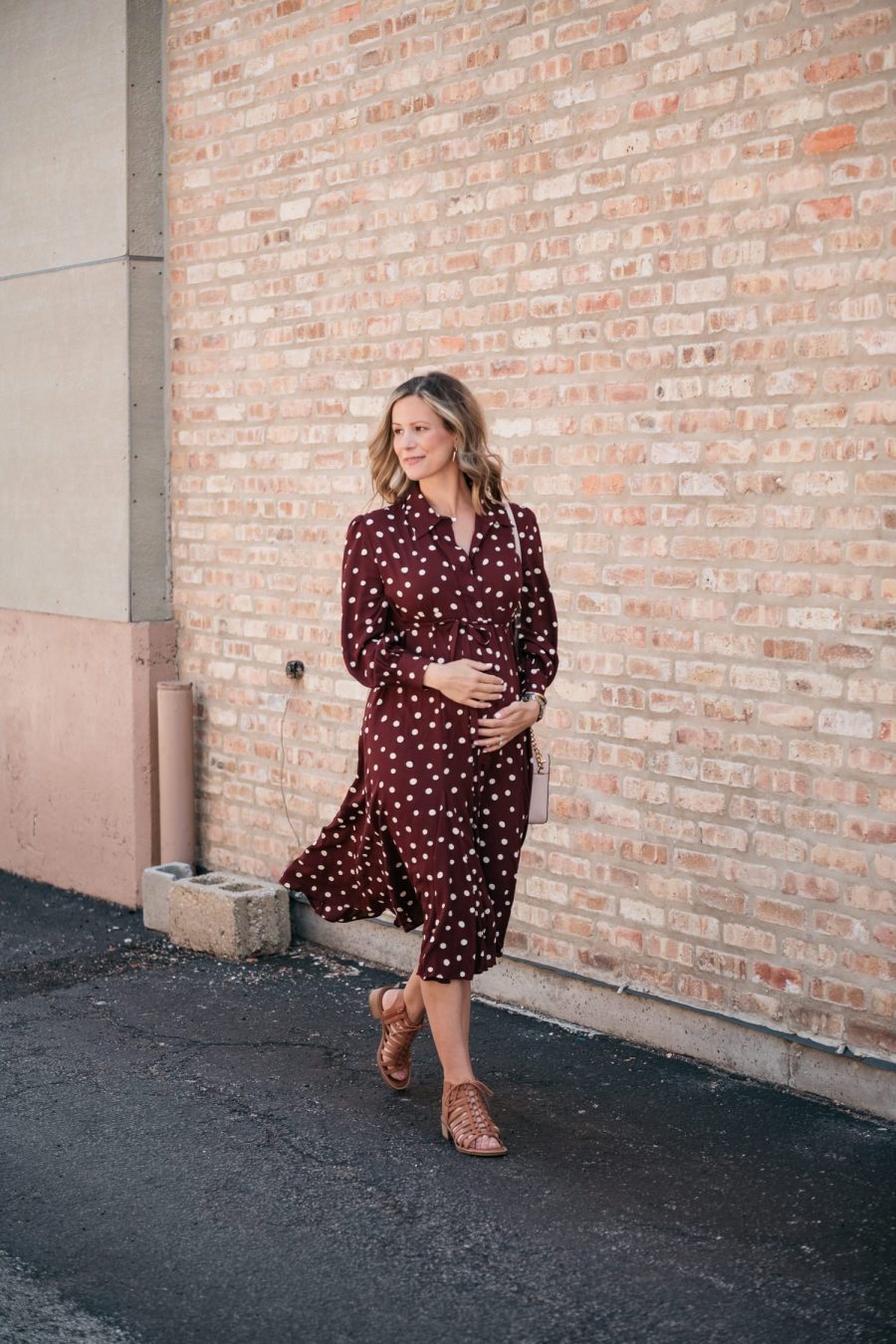 Maternity style: polka dot shirt dress, cross body bag, and sandals