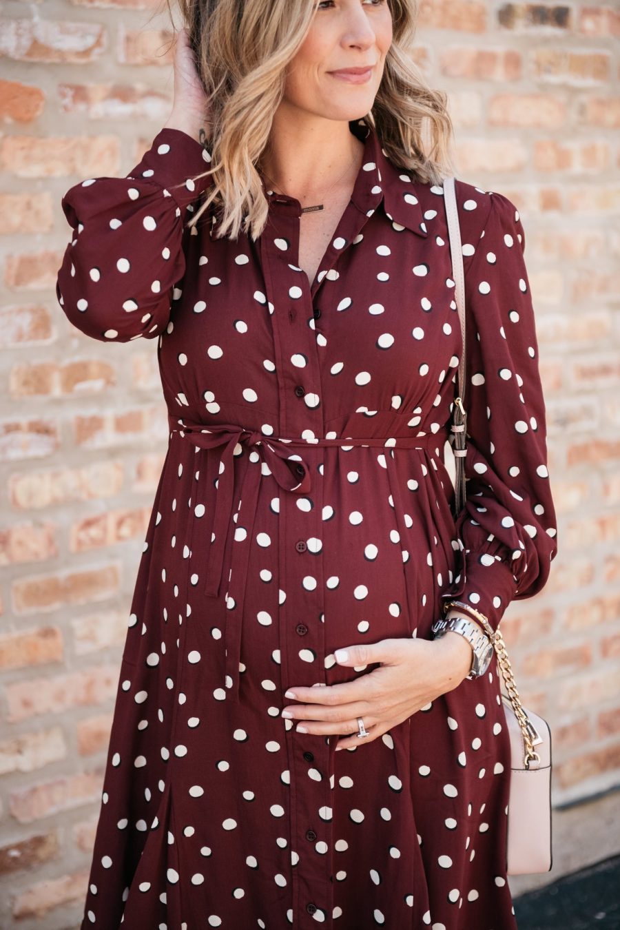 Maternity style: polka dot shirt dress, cross body bag, and sandals