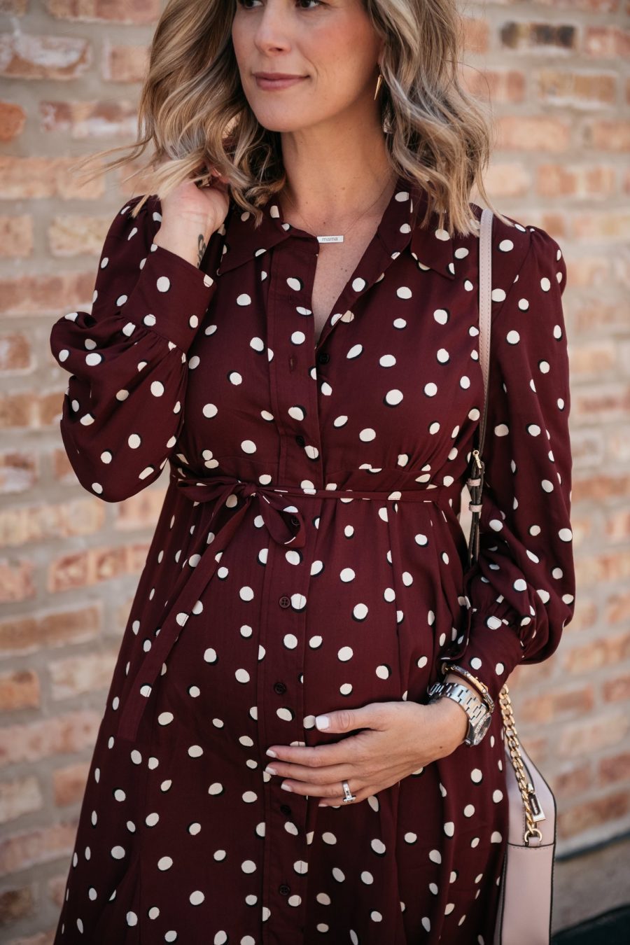 Maternity style: polka dot shirt dress, cross body bag, and sandals
