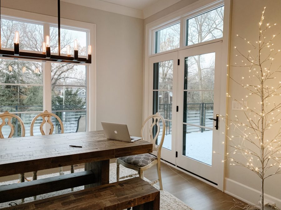 Home finds: dining room table, wood bench, rug, lighted birch tree
