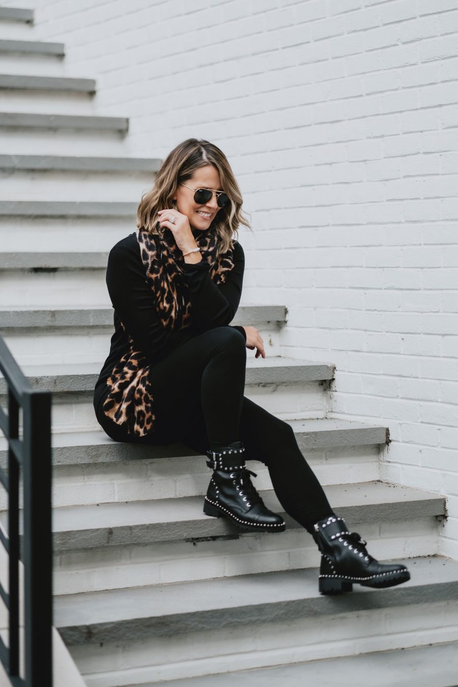 Edgy outfit ideas--all black with leopard scarf and combat boots