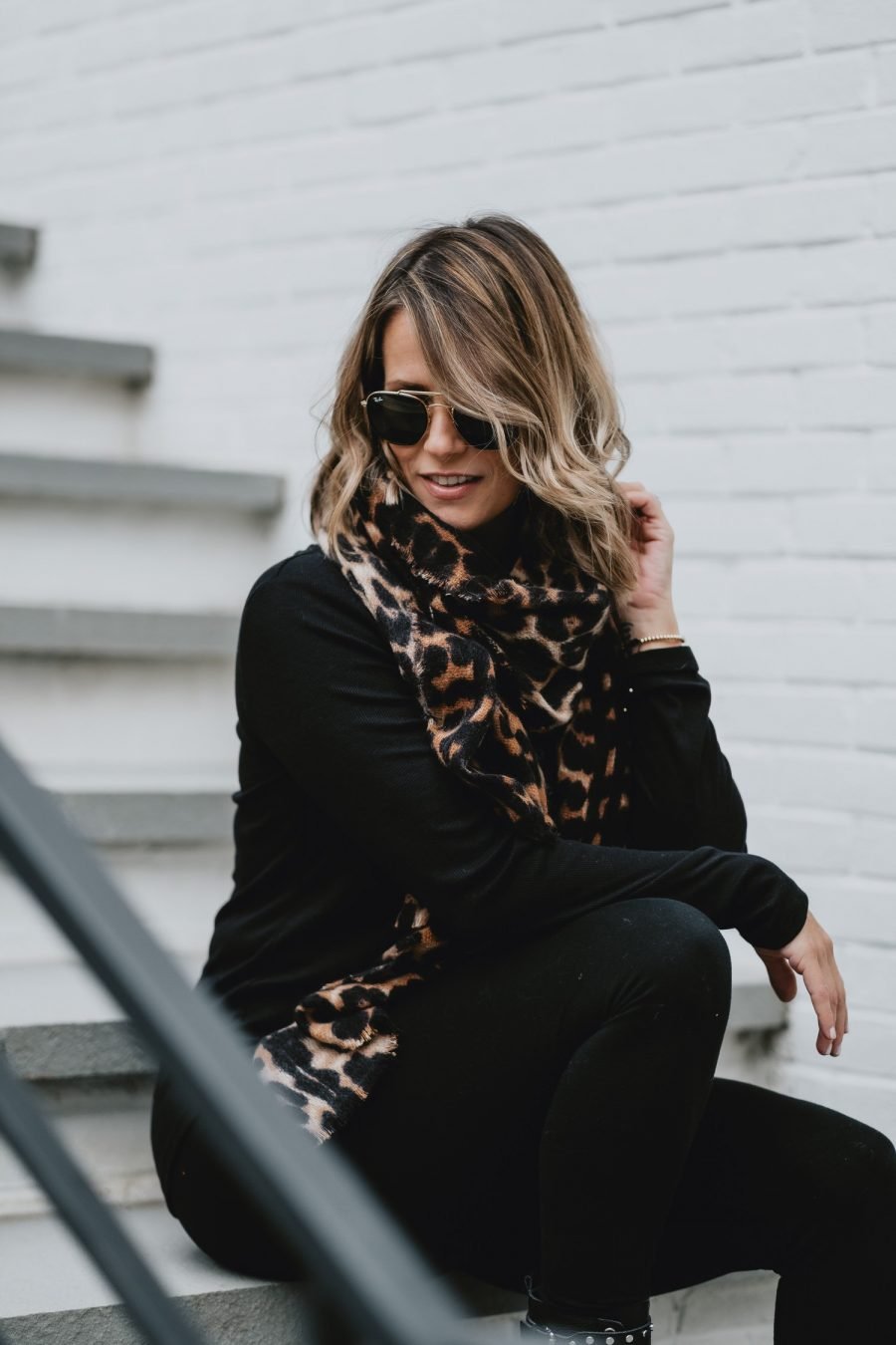 Edgy outfit ideas--all black with leopard scarf and combat boots