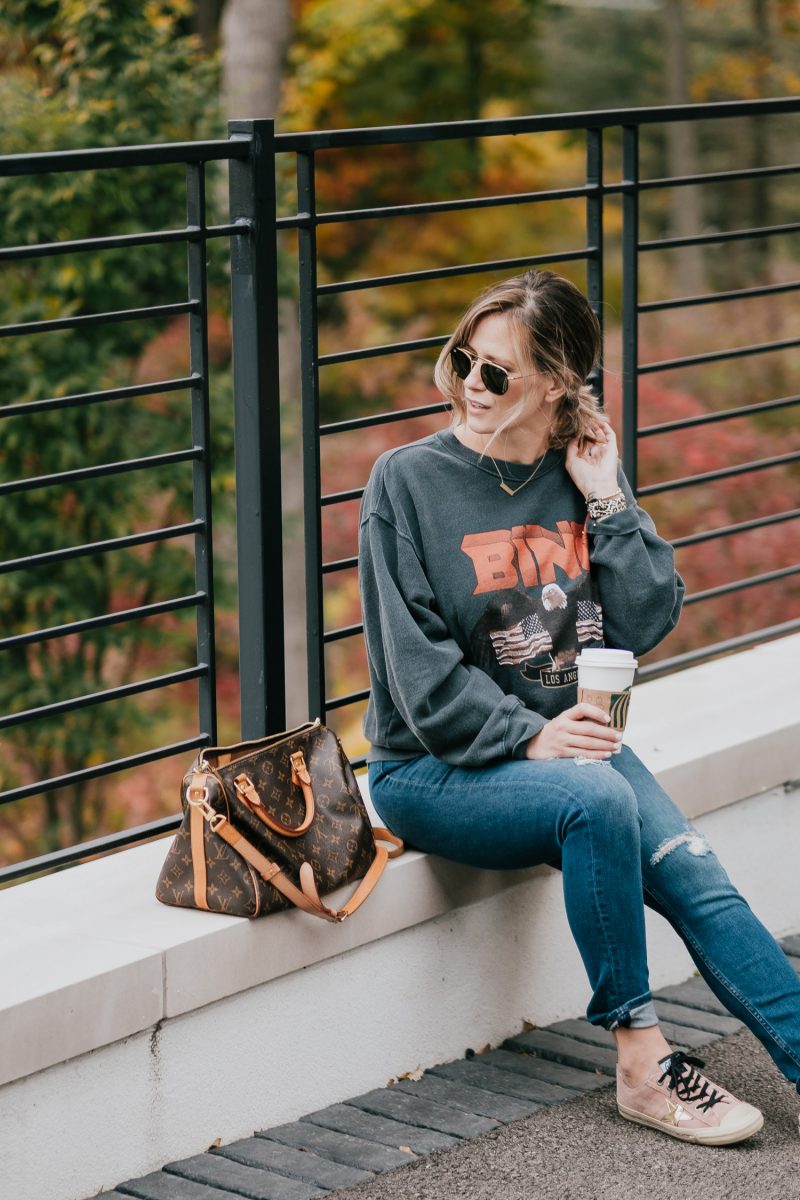 Postpartum casual outfit: sweatshirt, jeans, and sneakers