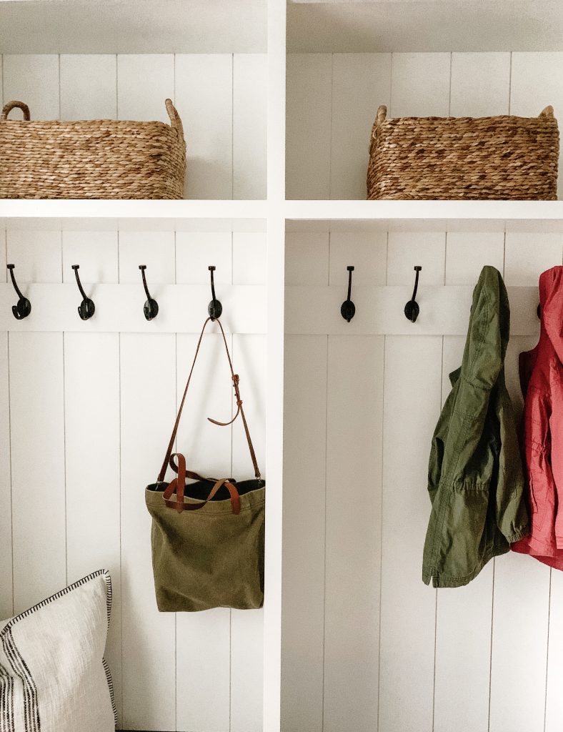 I'm sharing a glimpse into our mudroom and my favorite baskets, hooks, and bins to keep the space organized and give easy access to the kids.
