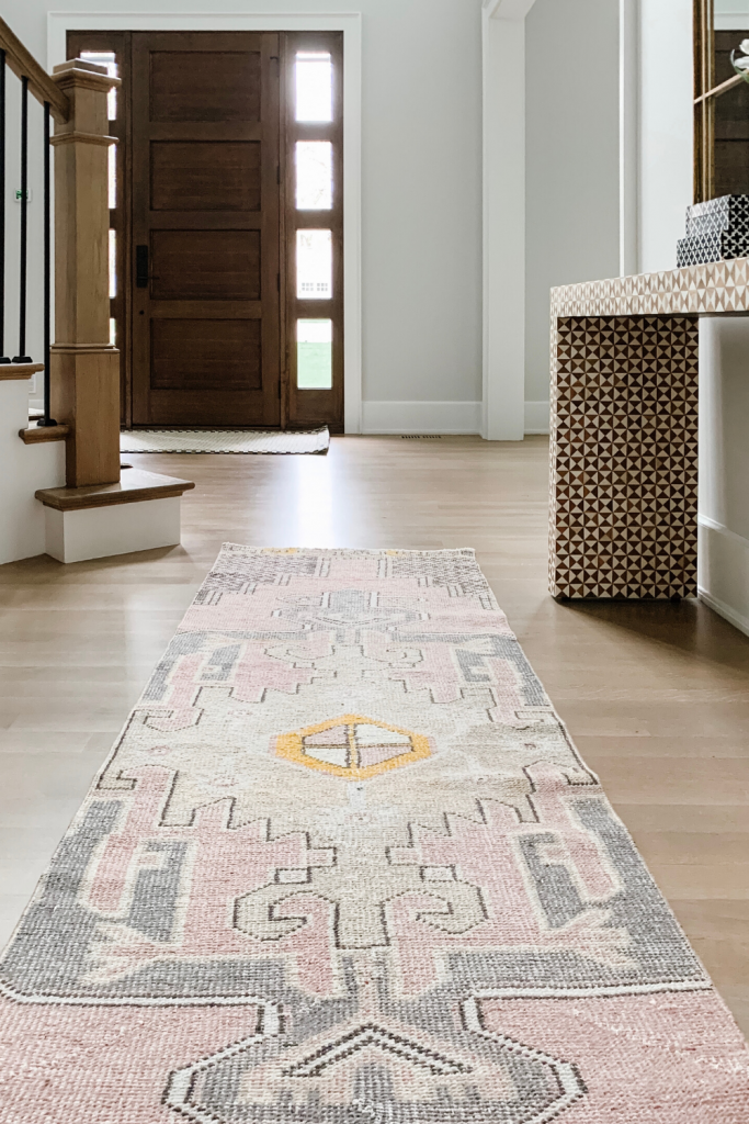 I found the most fabulous vintage rug on Etsy that compliments our entryway perfectly, I'm sharing the details along with some other decor.