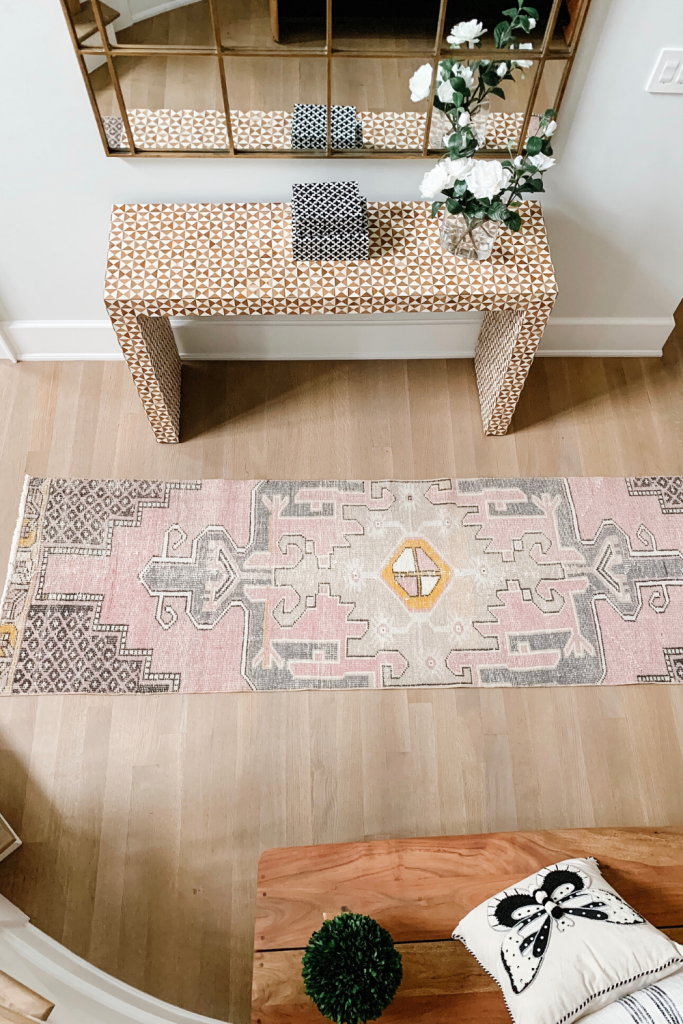I found the most fabulous vintage rug on Etsy that compliments our entryway perfectly, I'm sharing the details along with some other decor.