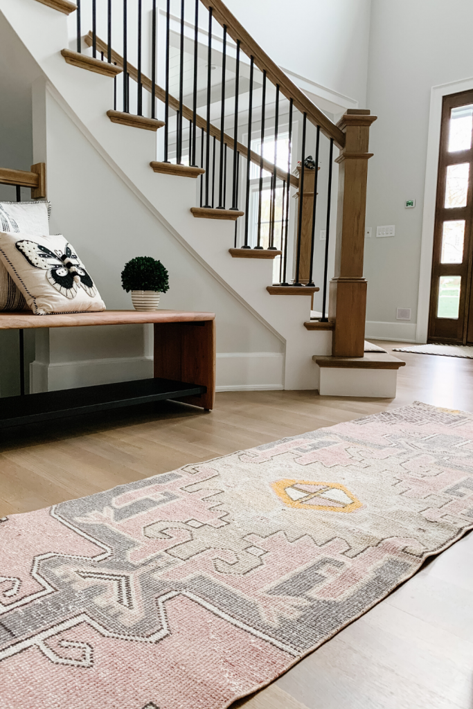 I found the most fabulous vintage rug on Etsy that compliments our entryway perfectly, I'm sharing the details along with some other decor.