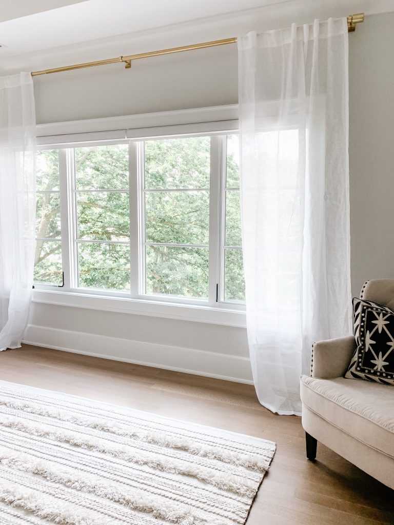 I'm sharing our cozy and neutral master bedroom complete with new curtains, comfy bedding, a floor length mirror, and the Samsung tv frame. 