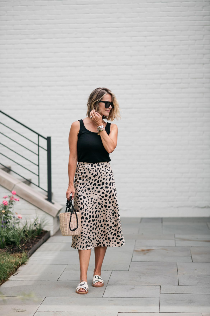 I'm sharing a classic leopard slip skirt and how I'm transitioning it from summer to fall with a classic tank, denim jacket, and accessories.