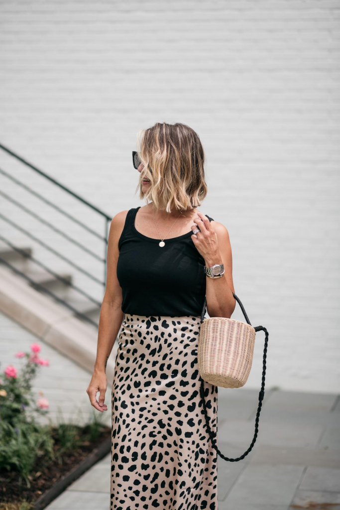 I'm sharing a classic leopard slip skirt and how I'm transitioning it from summer to fall with a classic tank, denim jacket, and accessories.