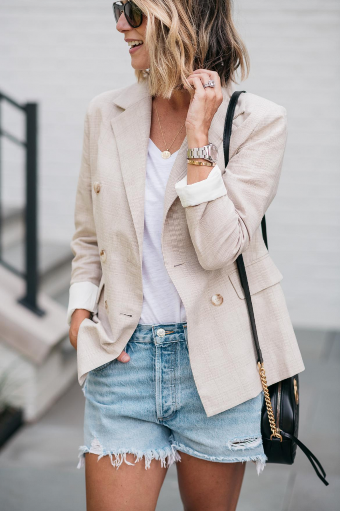 I'm pairing a chic boyfriend blazer with a pair of cut off denim shorts for the perfect outfit to transition from summer to fall.