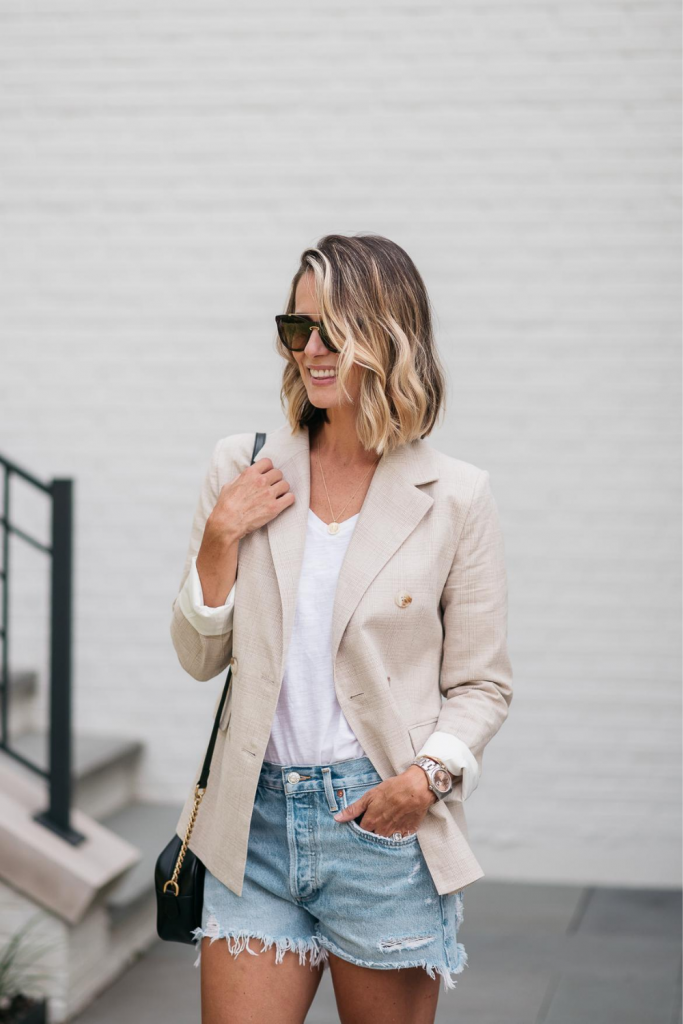 I'm pairing a chic boyfriend blazer with a pair of cut off denim shorts for the perfect outfit to transition from summer to fall.