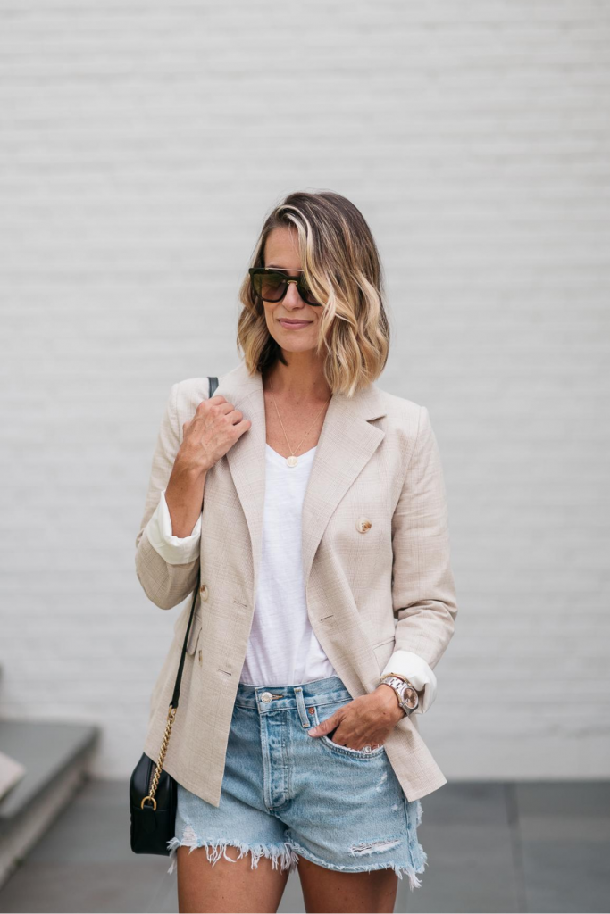 I'm pairing a chic boyfriend blazer with a pair of cut off denim shorts for the perfect outfit to transition from summer to fall.