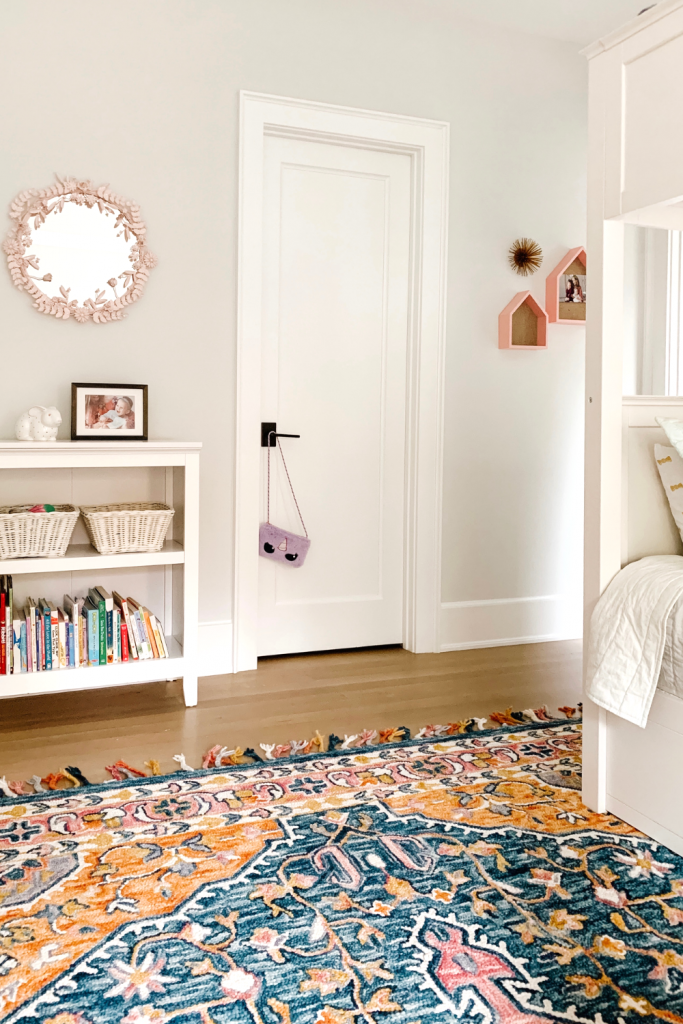 Transition to a big girl bedroom with bunkbeds, vibrant pops of color, and a cozy reading area.