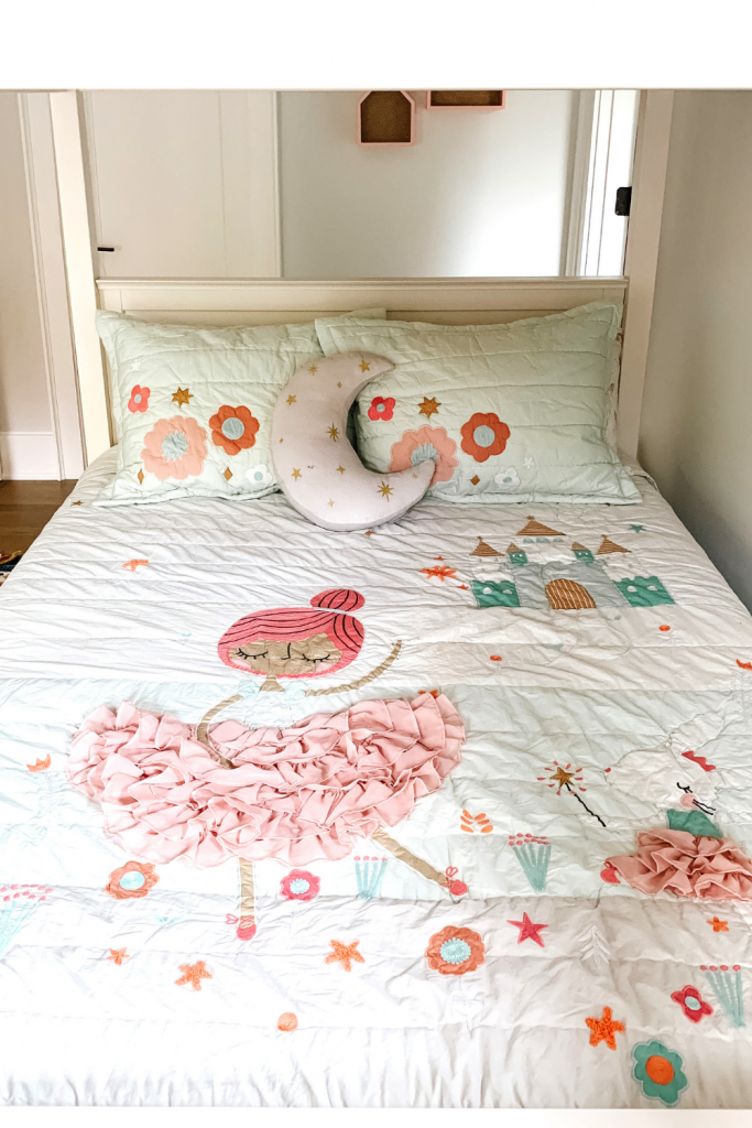 Transition to a big girl bedroom with bunkbeds, vibrant pops of color, and a cozy reading area.