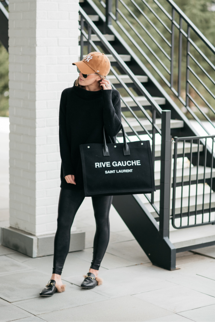 How to style a cozy black Free People tunic with black faux leather Spanx leggings and mules.  