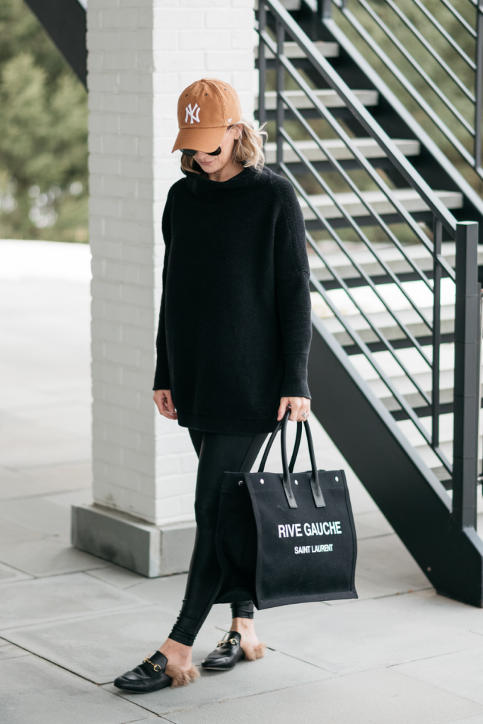 How to style a cozy black Free People tunic with black faux leather Spanx leggings and mules.  
