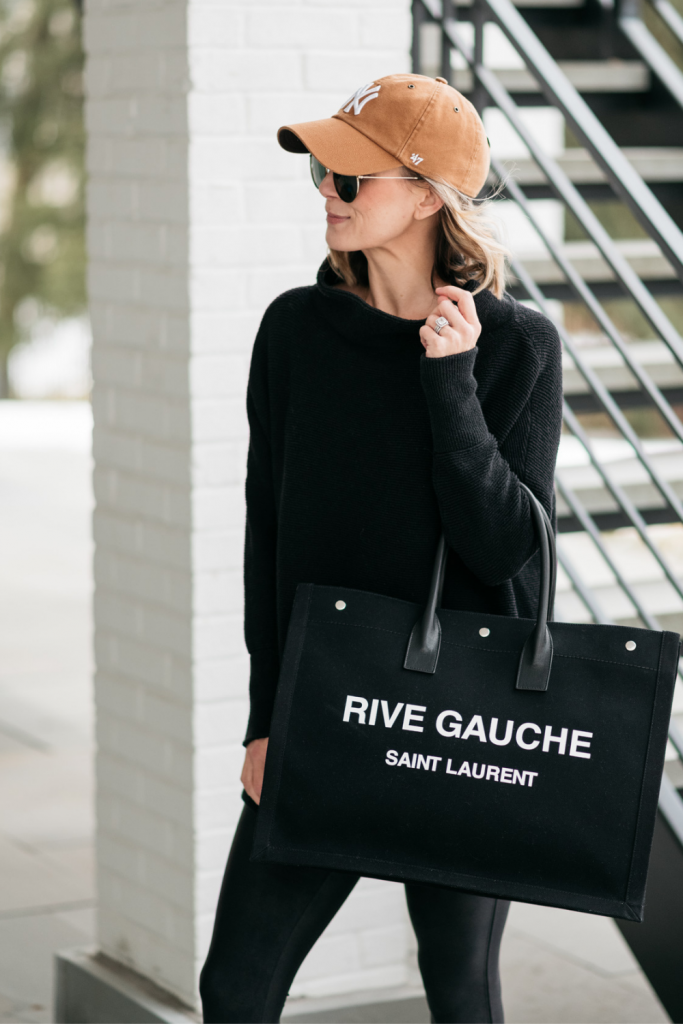 How to style a cozy black Free People tunic with black faux leather Spanx leggings and mules.