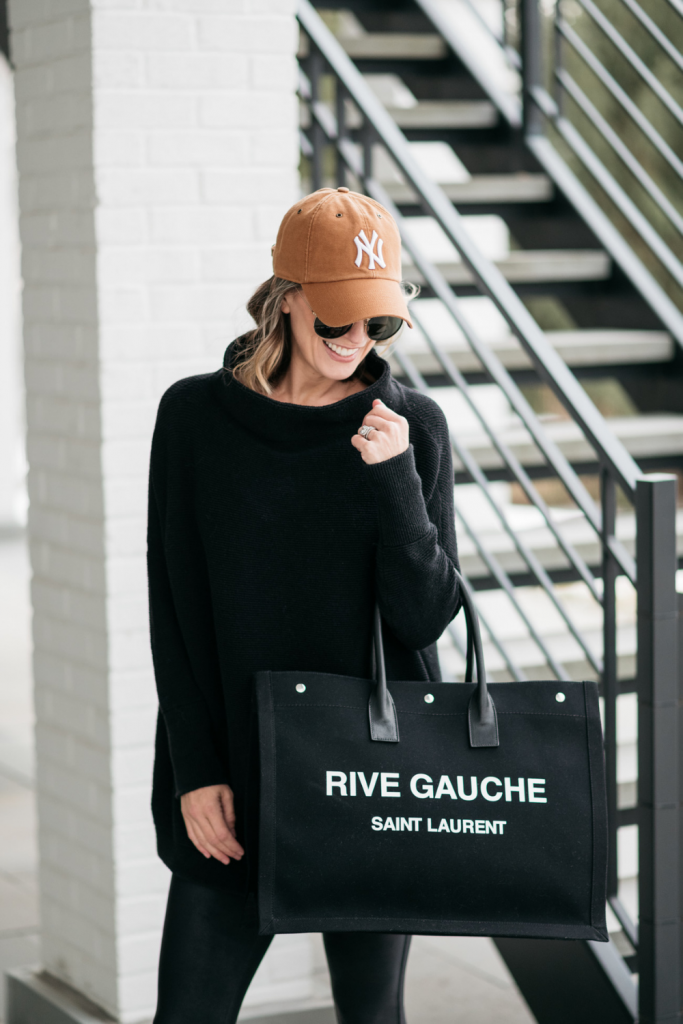 How to style a cozy black Free People tunic with black faux leather Spanx leggings and mules.