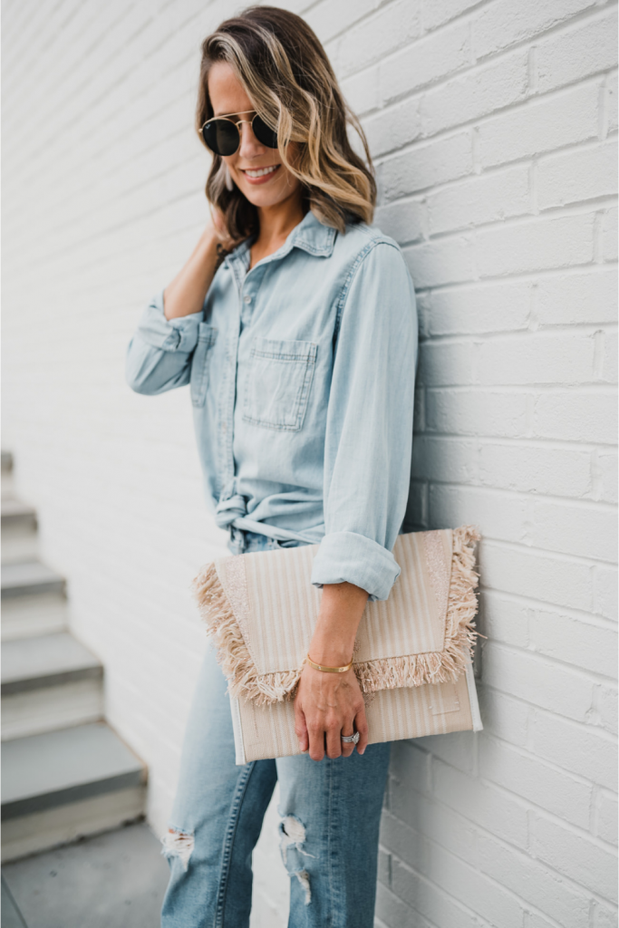 Date night: denim on denim, clutch, sunglasses, and heels