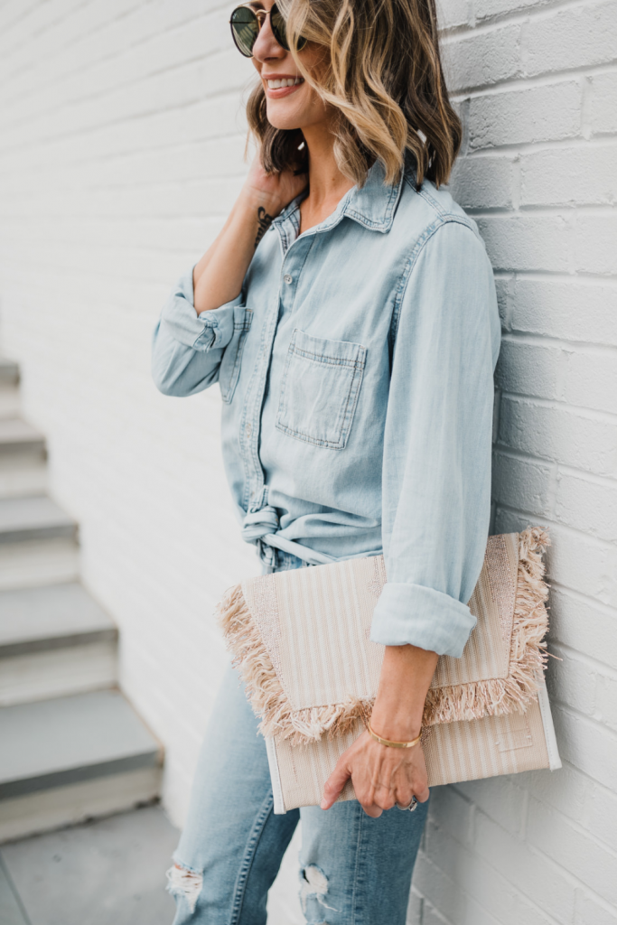 Date night: denim on denim, clutch, sunglasses, and heels
