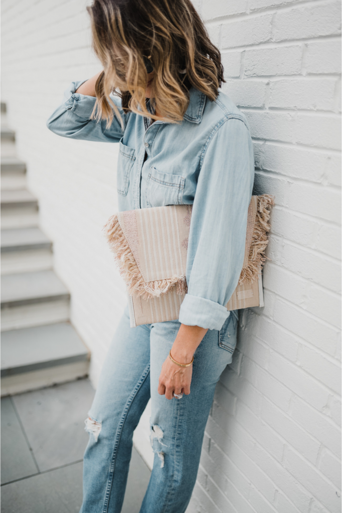 Date night: denim on denim, clutch, sunglasses, and heels