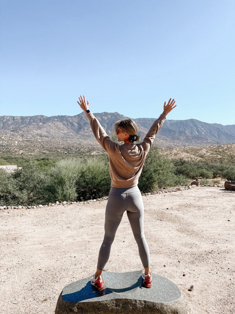 Suzanne standing on a rock in leggings and pullover. What I've learned in 2 years of sobriety 