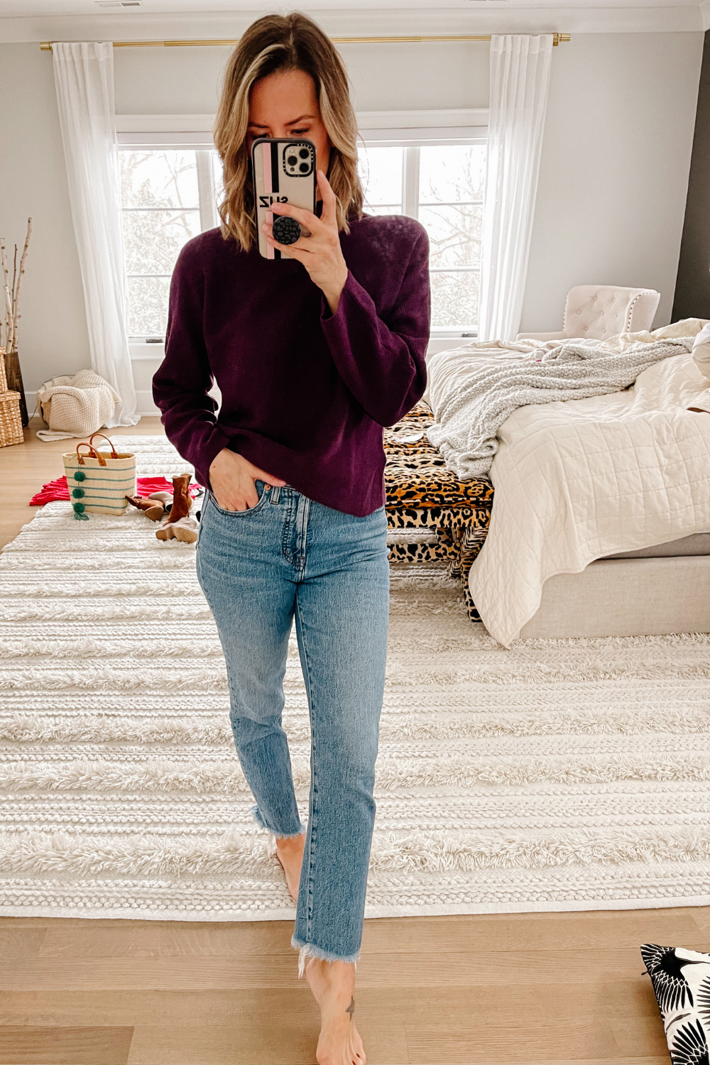 Suzanne wearing a Lululemon sweater and denim