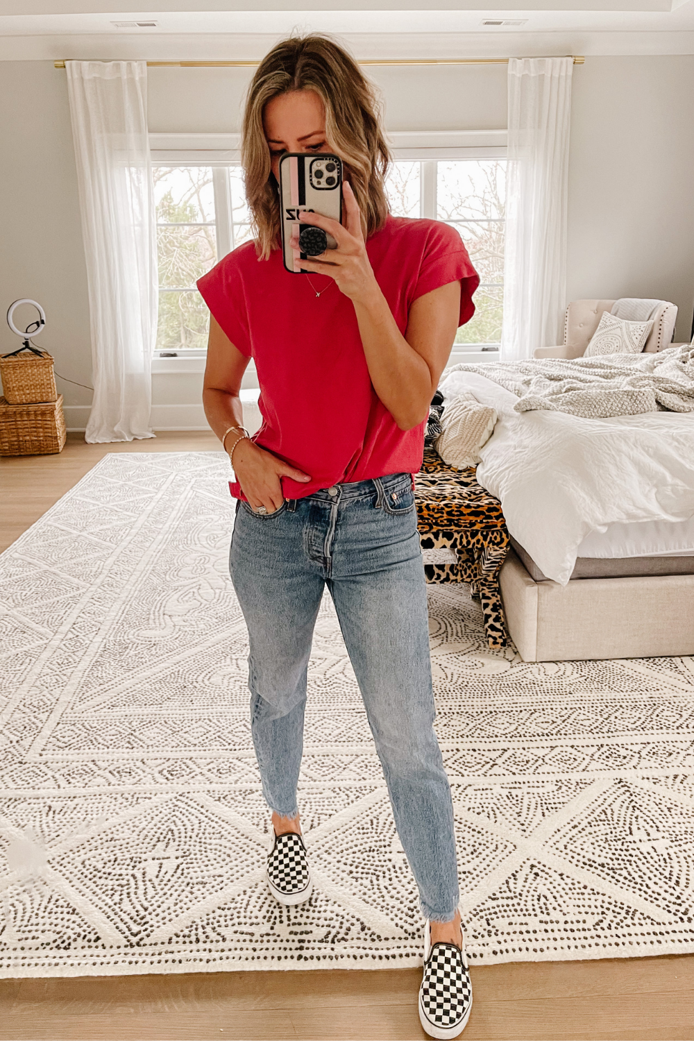 Suzanne wearing a $10 muscle tank, denim jeans and checkered vans