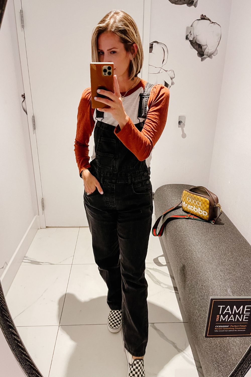 Suzanne wearing a pair of Free People overalls at the hair salon