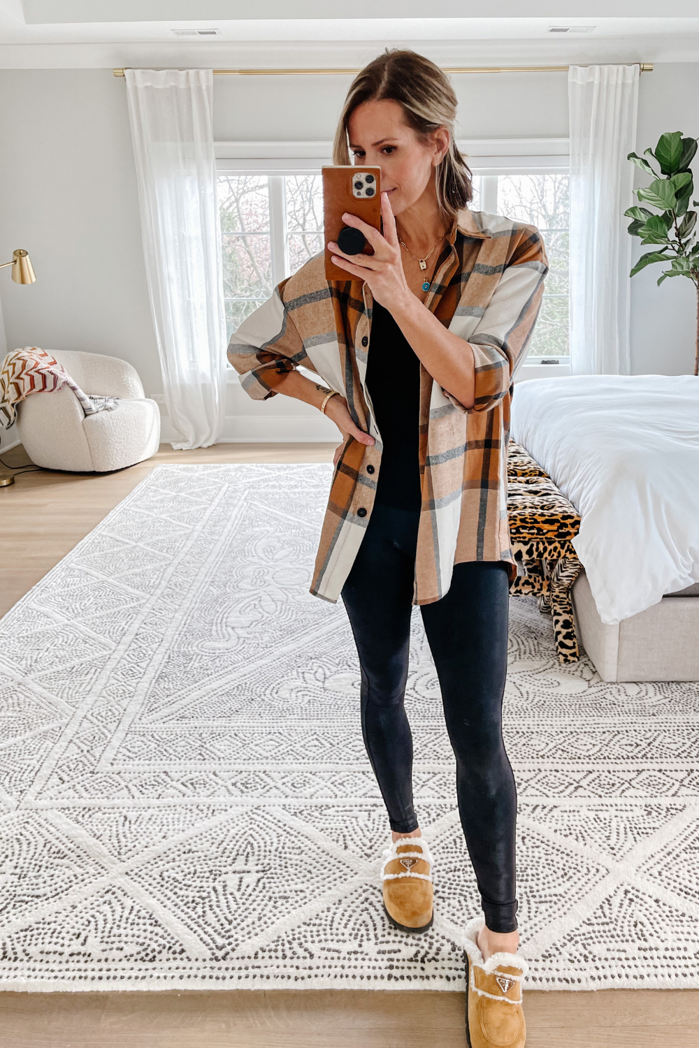 Suzanne wearing a plaid shacket and Spanx leggings