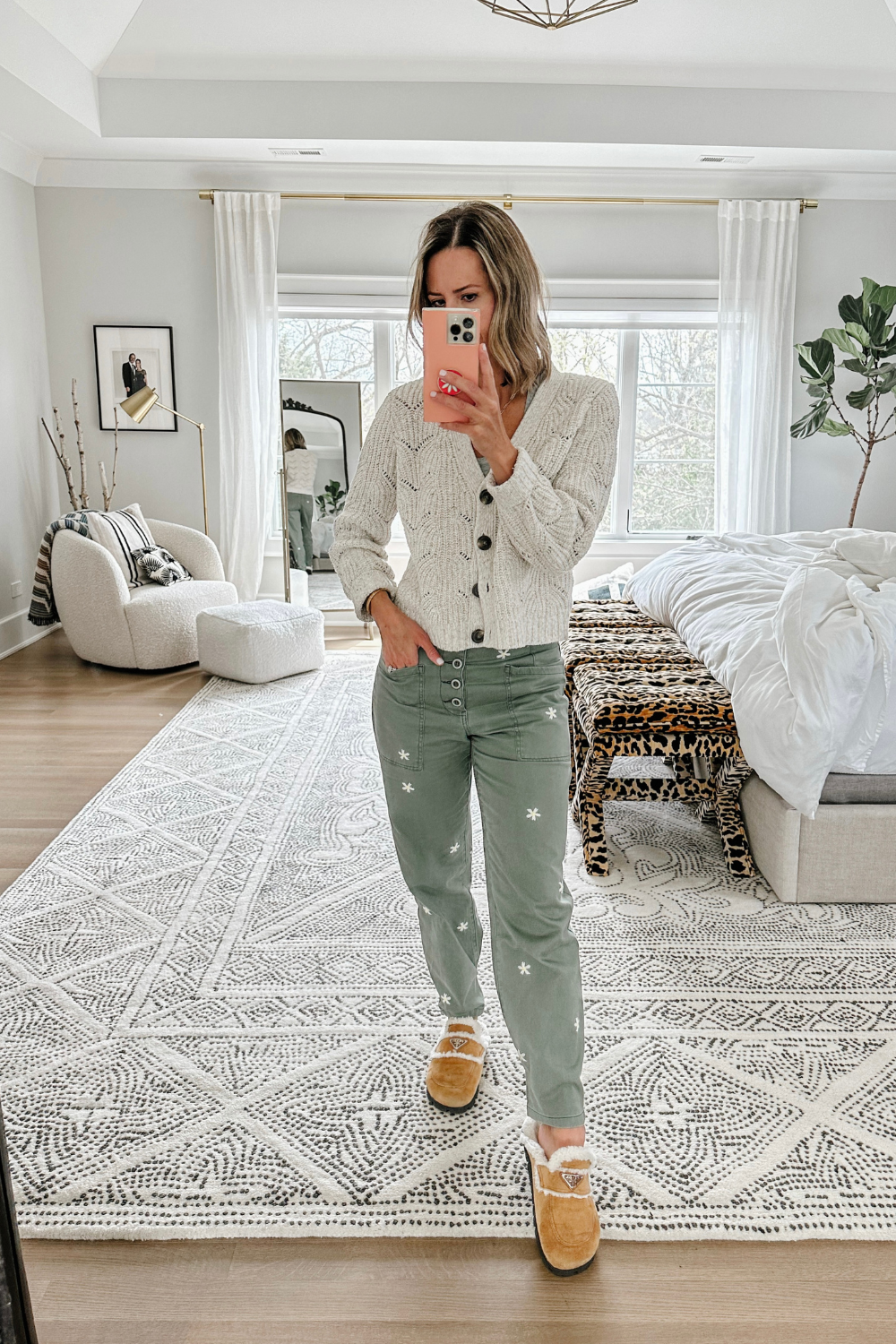 Suzanne wearing a cardigan and Pistola trousers