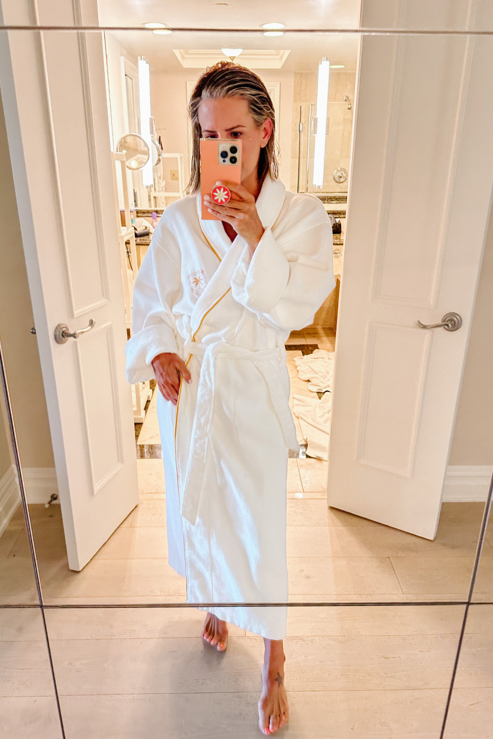 Suzanne in a white hotel robe at The Boca Raton
